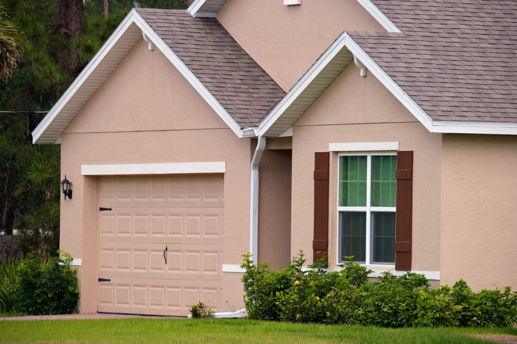 wide-garage-double-door-and-concrete-driveway-of-new-modern-american-house-4-1024x682