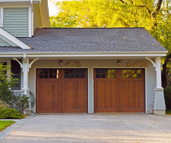Garage door repair technicians replacing a broken spring in San Rafael