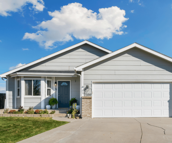 Garage door repair technicians replacing a broken spring in Foster City