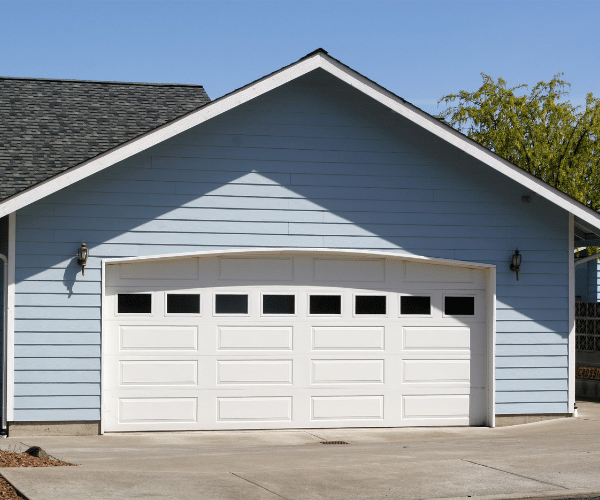 Garage door repair technicians replacing a broken spring in Sausalito