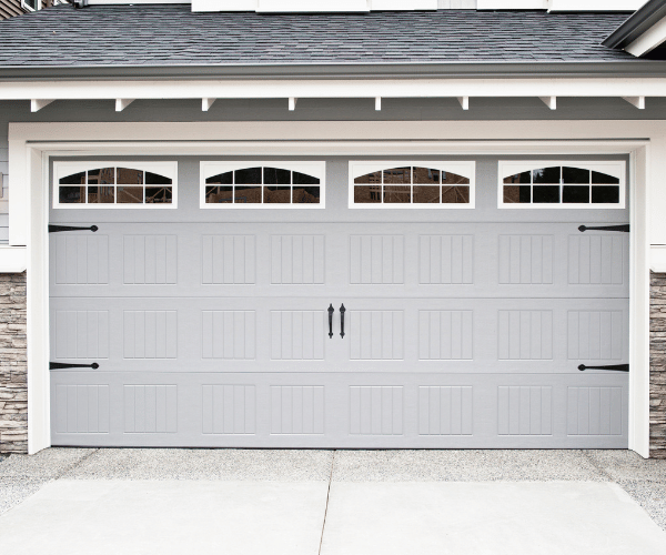 Garage door repair technicians replacing a broken spring in Mill Valley