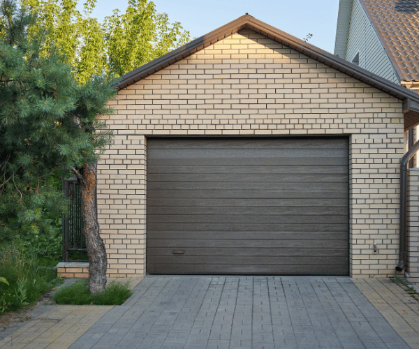 Garage door repair technicians replacing a broken spring in San Francisco