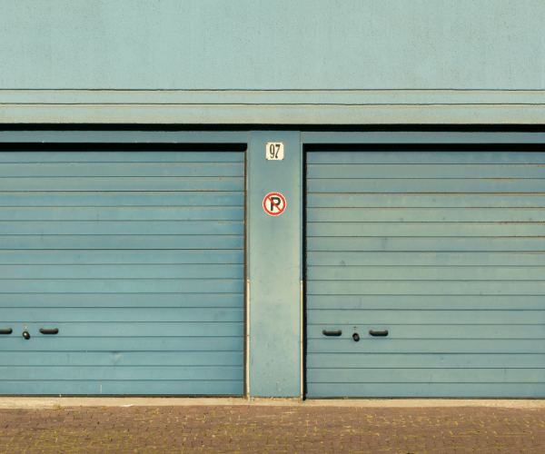 Garage door repair technicians replacing a broken spring in Tiburon