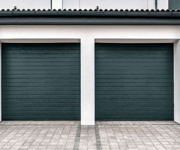 Garage door repair technicians replacing a broken spring in Millbrae