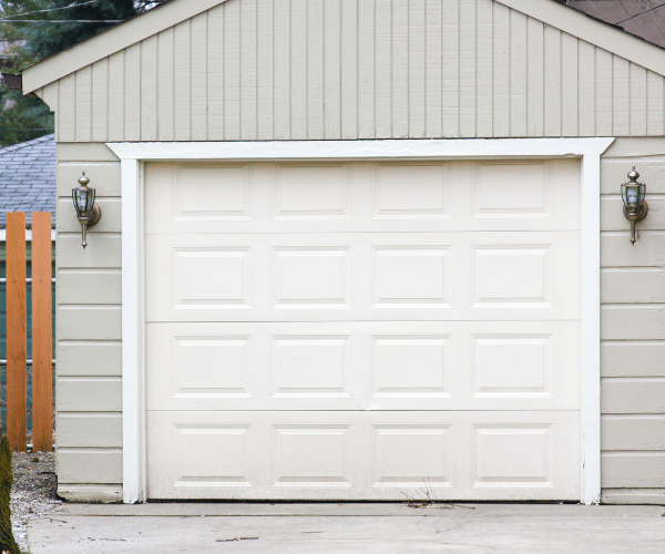 Garage door repair technicians replacing a broken spring in Richmond