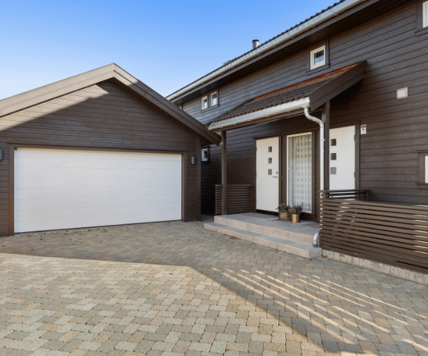 Garage door repair technicians replacing a broken spring in Foster City