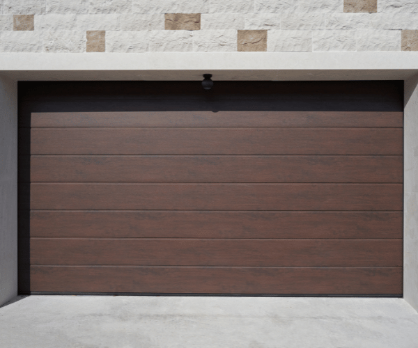 Garage door repair technicians replacing a broken spring in Sausalito