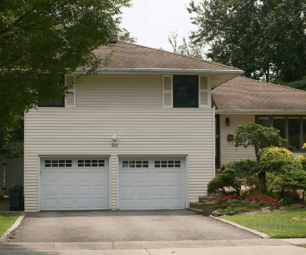Garage door repair technicians replacing a broken spring in San Francisco