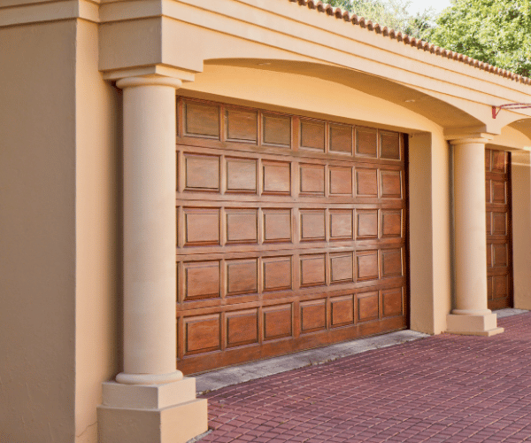 Garage door repair technicians replacing a broken spring in Tiburon