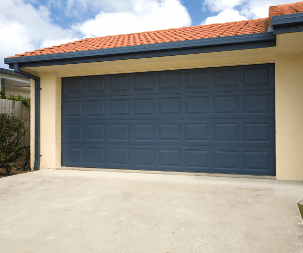 Garage door repair technicians replacing a broken spring in Millbrae