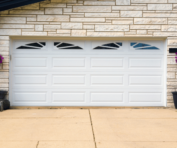 Garage door repair technicians replacing a broken spring in Daly City
