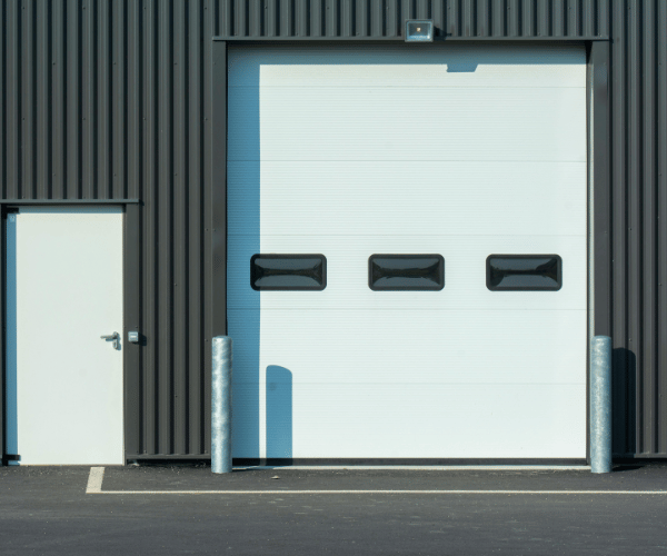 Garage door repair technicians replacing a broken spring in Burlingame