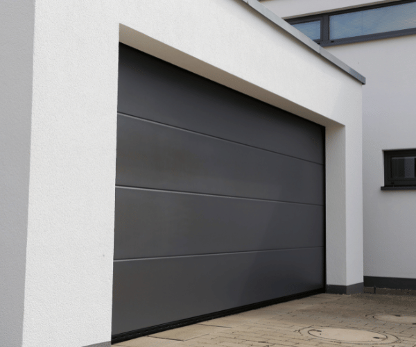 Garage door repair technicians replacing a broken spring in San Rafael