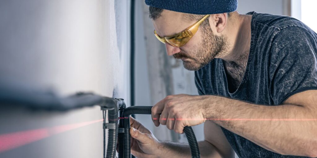 Garage door technician inspecting a malfunctioning garage door in San Francisco