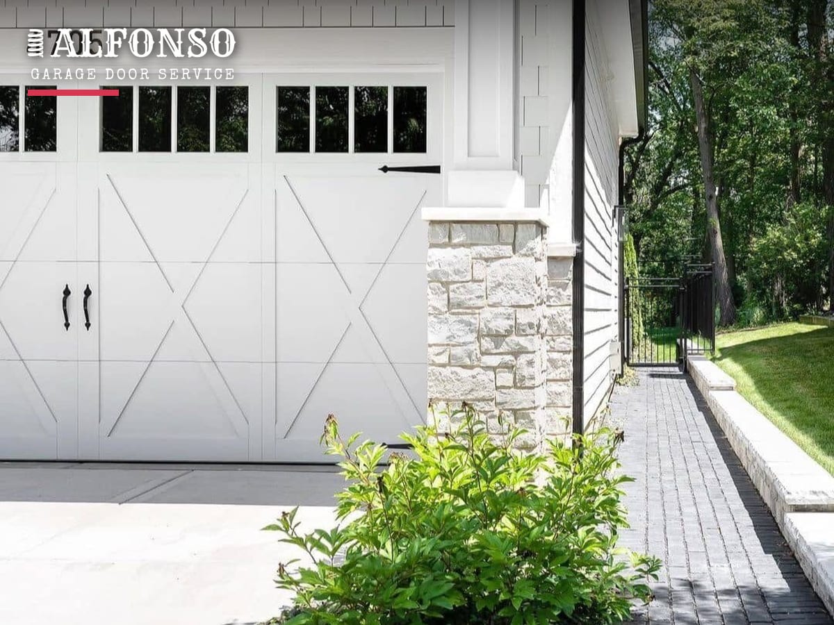 White carriage-style garage door with black handle and lock hardware on a San Francisco home